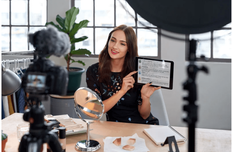 woman filming on device social media