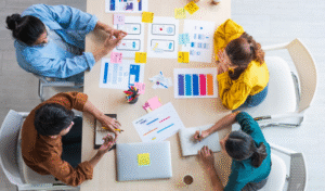 four people working at table